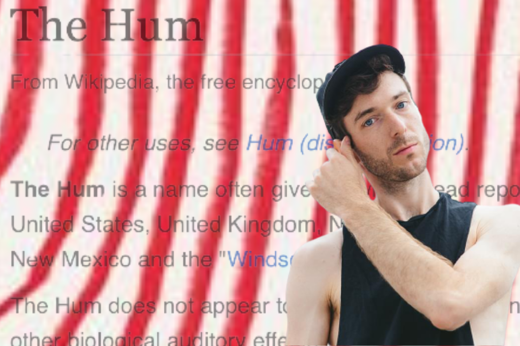 A photograph of Jordan Tannahill in front of a Wikipedia screenshot describing The Hum. There are red lines across the Wikipedia text, reminiscent of those on The Listeners' front cover.