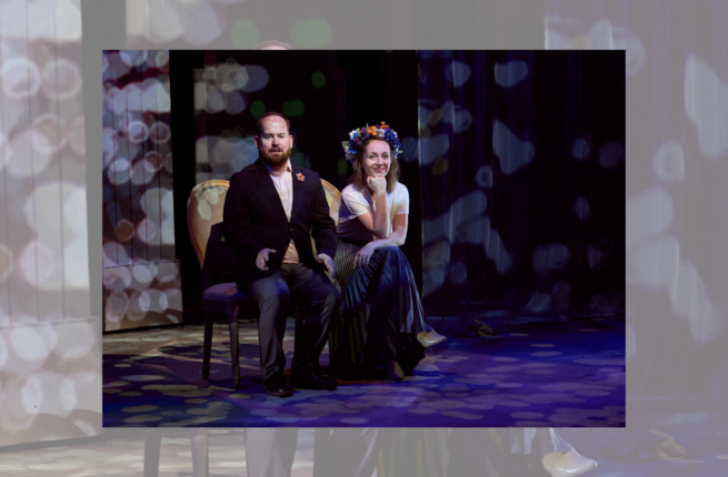 Canadian playwright Matthew MacKenzie and the Ukrainian artist Mariya Khomutova sitting in costume on stage