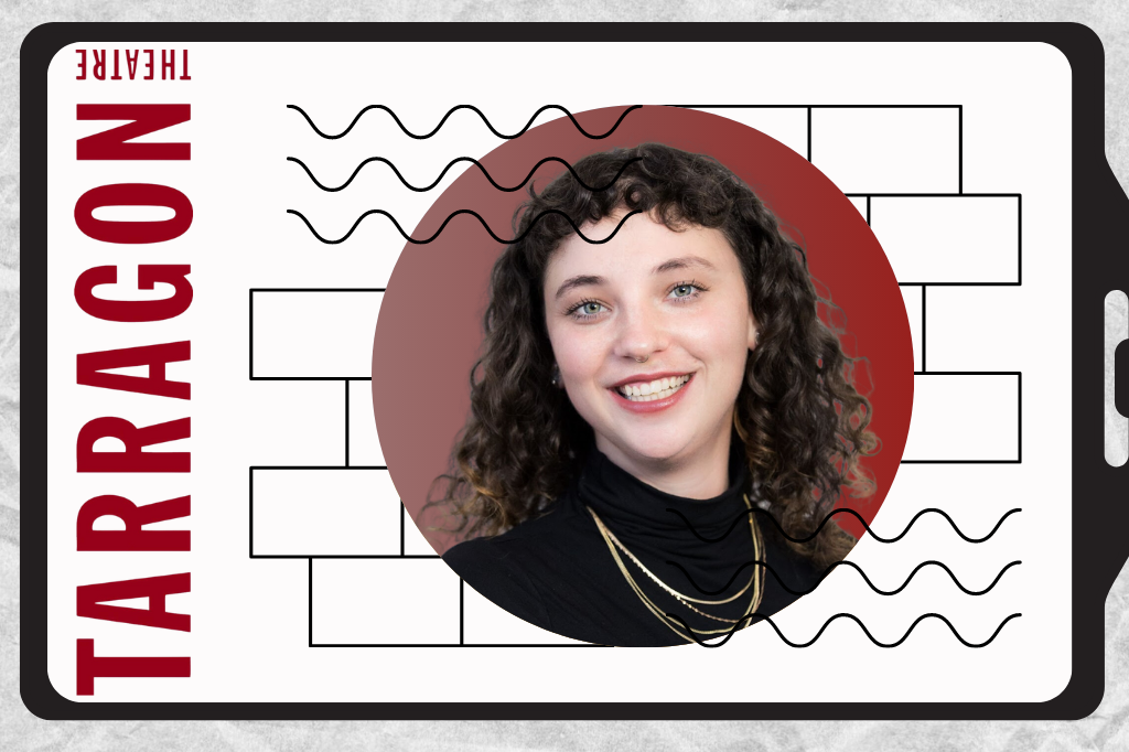 A circular image of Heather Caplap rests on a graphic lanyard. Heather has curly dark hair, green eyes, and a septum piercing and smiles widely at the camera. She wears a black turtleneck with layered gold necklaces. Surrounding her image are graphic line shapes. On the left of the image in Tarragon Theatre's logo, which matches the red background of Heather's headshot.