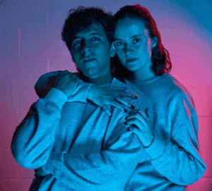 Two people arms around each other