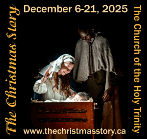 Joseph and Mary gaze down at baby Jesus in the manger.