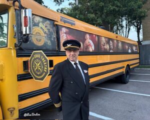 Bus Driver standing outside of a bus