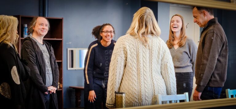 5 people in a circle playing Drama games.