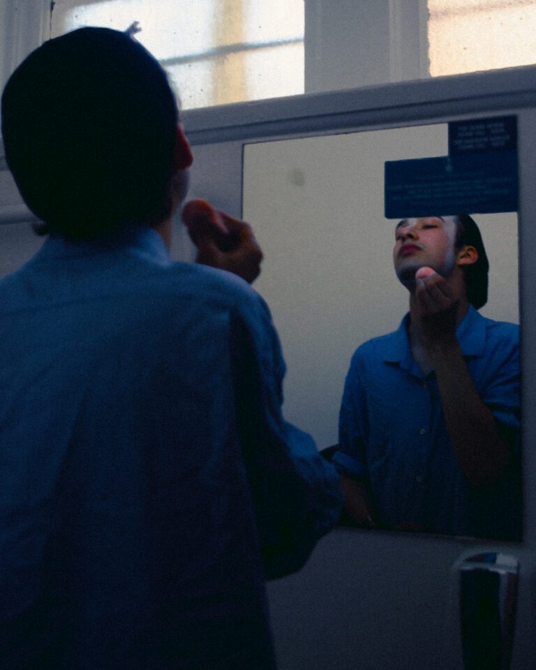 Charles Ford getting into make up and costume before a run.