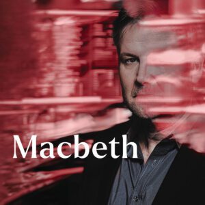 Man with red reflections covering part of his face