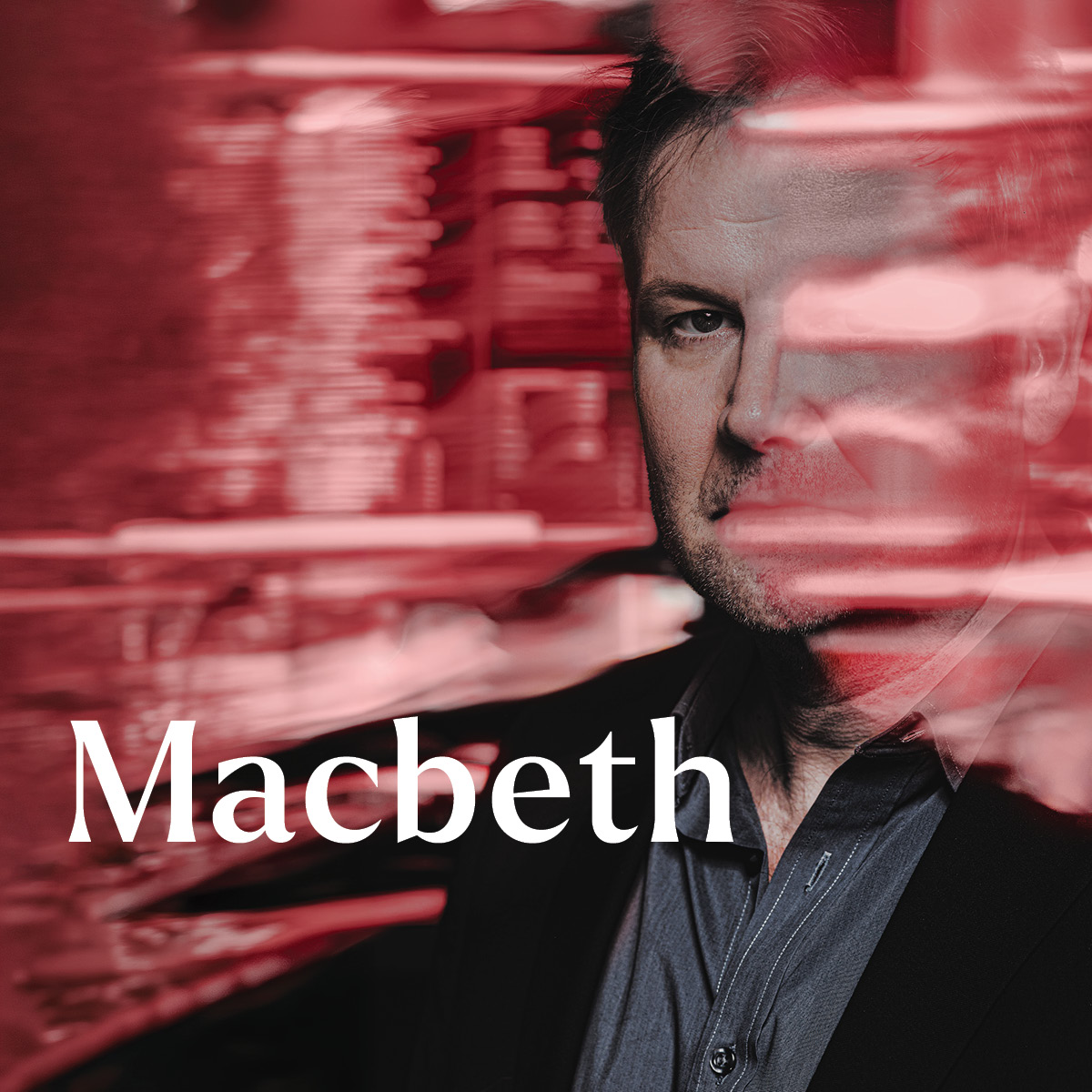 Man with red reflections covering part of his face